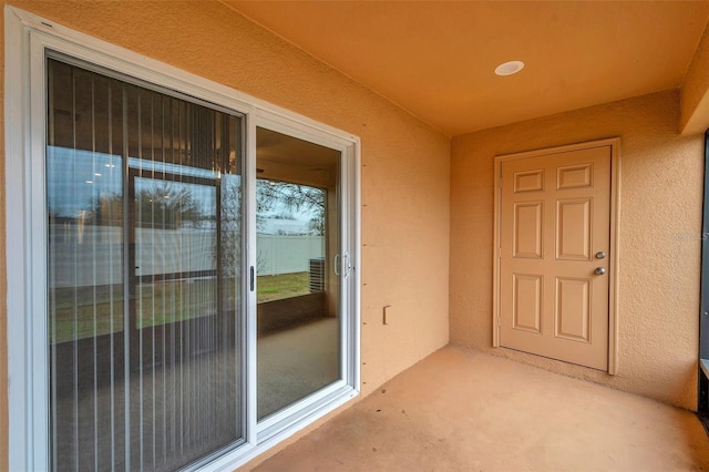 entrance to property with a patio