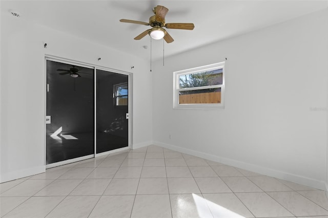 unfurnished bedroom with ceiling fan, a closet, and light tile patterned floors