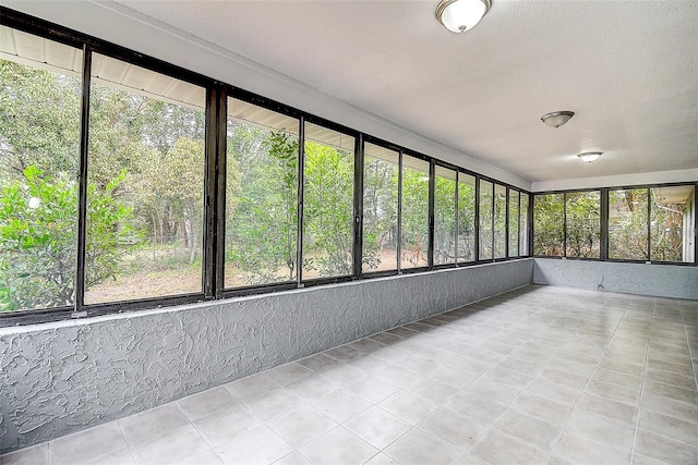 unfurnished sunroom featuring a healthy amount of sunlight