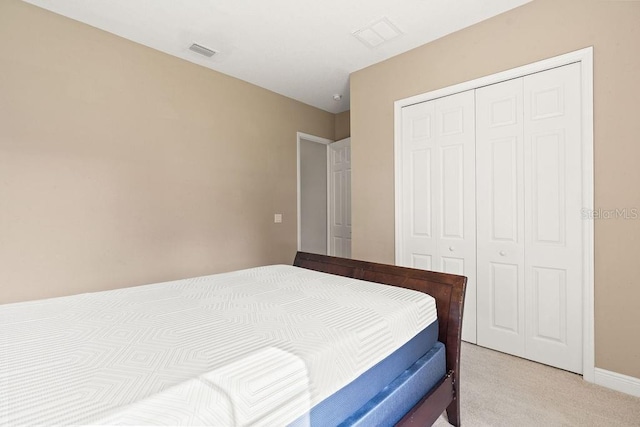 carpeted bedroom featuring a closet