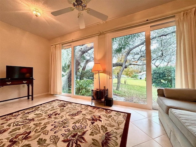 interior space with ceiling fan and light tile patterned floors