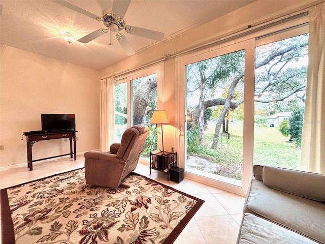 sitting room with ceiling fan and light tile patterned floors