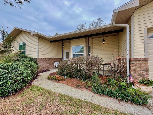 property entrance with covered porch