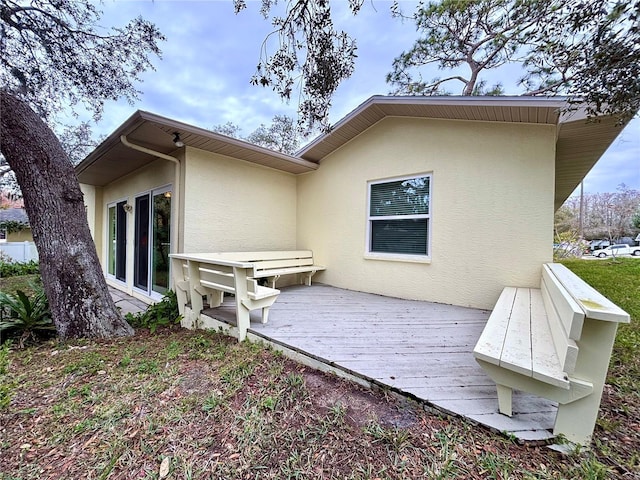 rear view of house with a wooden deck