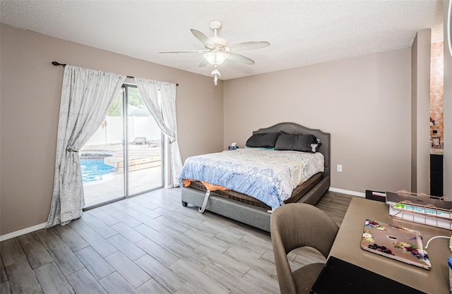 bedroom featuring ceiling fan, light hardwood / wood-style floors, a textured ceiling, and access to outside