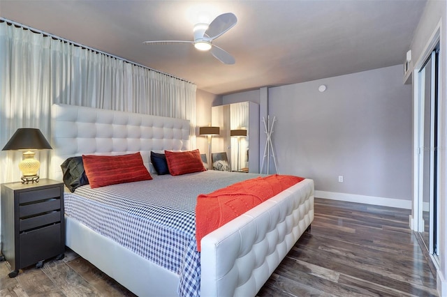 bedroom featuring dark hardwood / wood-style flooring and ceiling fan