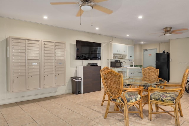 tiled dining area with ceiling fan and mail boxes