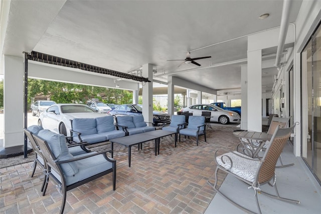 view of patio with outdoor lounge area and ceiling fan