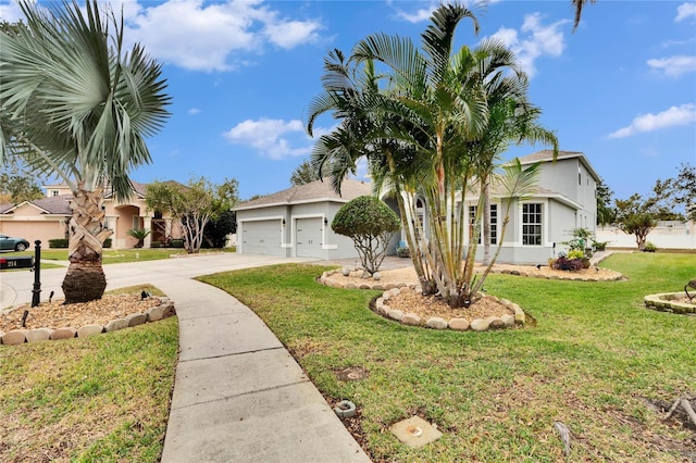 view of front of house featuring a front lawn and a garage