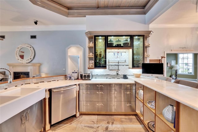 kitchen featuring sink, dishwasher, crown molding, and tasteful backsplash