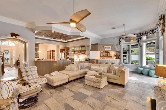 living room featuring ceiling fan and ornamental molding