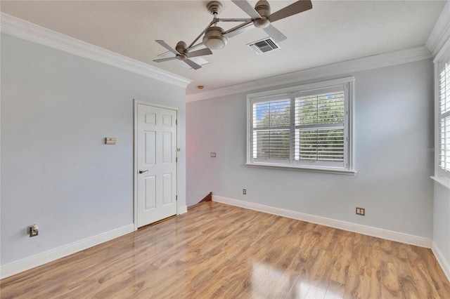 spare room with ceiling fan, light wood-type flooring, and ornamental molding