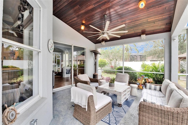 sunroom / solarium with vaulted ceiling, ceiling fan, and wood ceiling