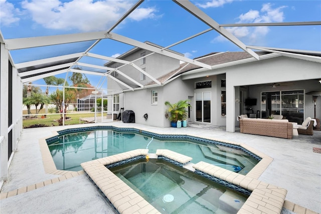 view of swimming pool featuring ceiling fan, an in ground hot tub, a lanai, an outdoor hangout area, and a patio