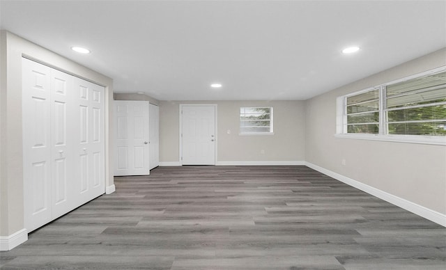 basement with dark hardwood / wood-style flooring