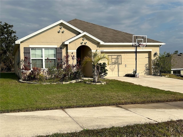 single story home featuring a garage and a front lawn