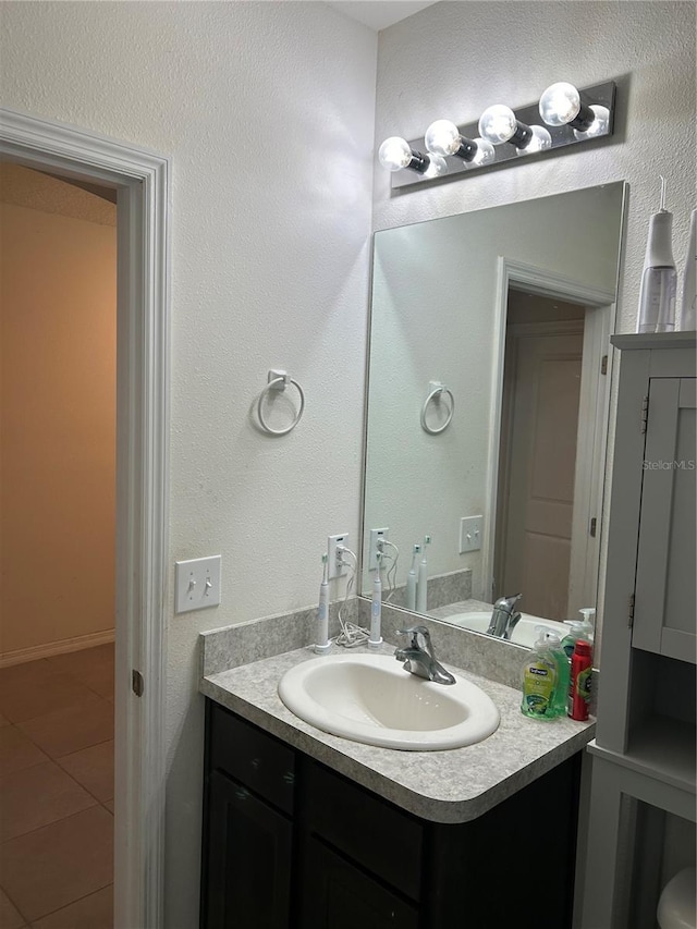 bathroom featuring tile patterned floors and vanity