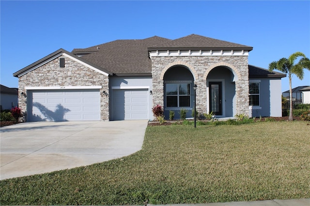 view of front facade with a front lawn and a garage