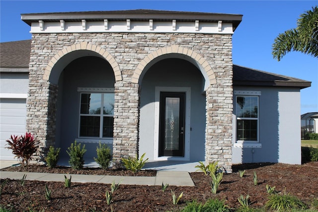 property entrance with a garage