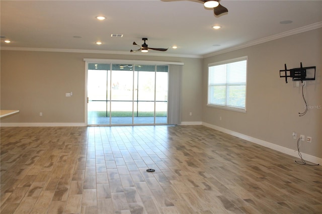 unfurnished room featuring ceiling fan and ornamental molding