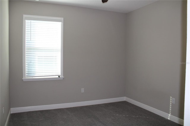 empty room with dark carpet