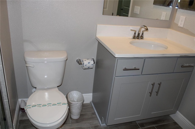 bathroom with toilet and vanity