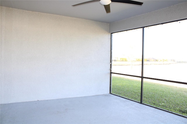 unfurnished room with ceiling fan