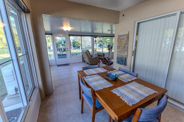 dining area featuring light tile patterned flooring