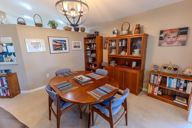 dining room featuring an inviting chandelier and light tile patterned floors