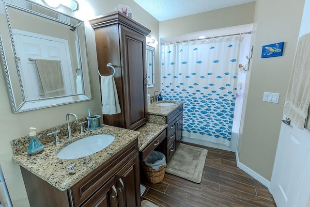 bathroom featuring vanity and shower / tub combo with curtain