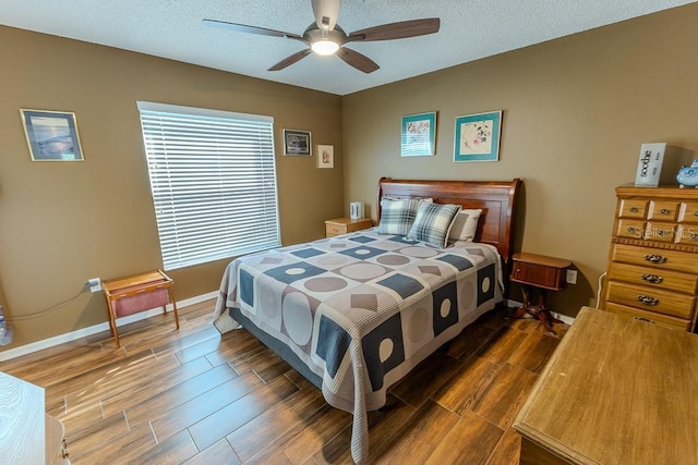 bedroom featuring a textured ceiling and ceiling fan