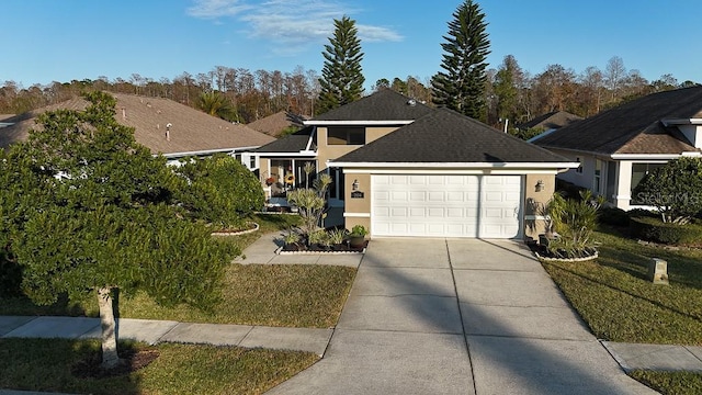 view of front facade with a garage and a front yard