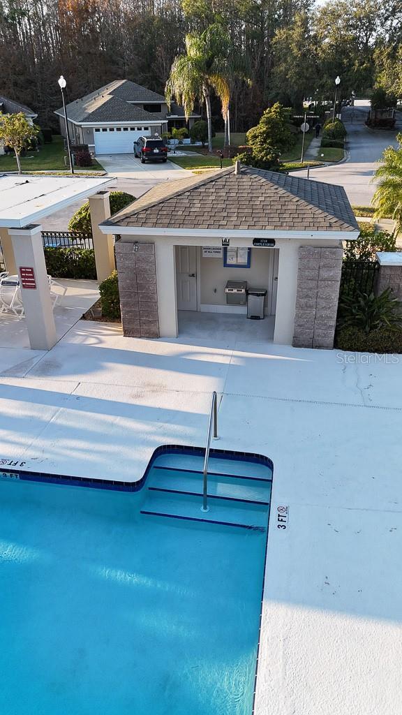 view of swimming pool featuring area for grilling