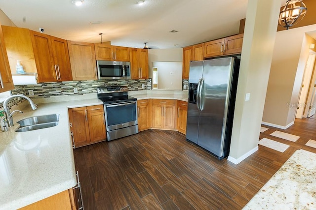 1604 Boswell Ln, New Port Richey, FL 34655 - kitchen with stainless steel appliances, a sink, decorative backsplash, and dark wood-style floors