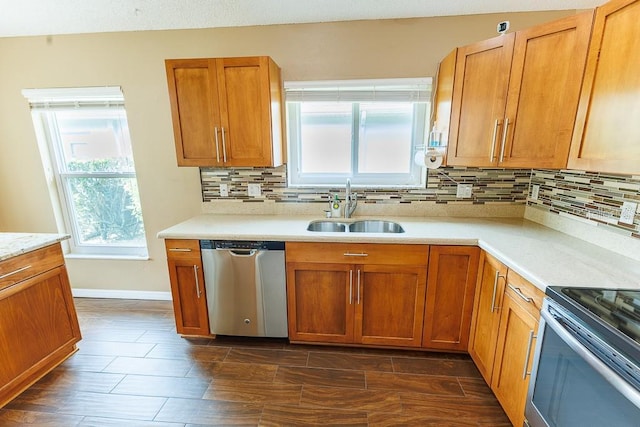1604 Boswell Ln, New Port Richey, FL 34655 - kitchen featuring dishwasher, a sink, decorative backsplash, light countertops, and brown cabinets