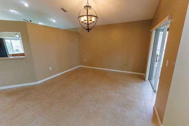 1604 Boswell Ln, New Port Richey, FL 34655 - unfurnished room with a chandelier, light tile patterned floors, and baseboards