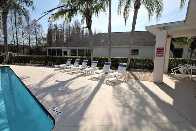 1604 Boswell Ln, New Port Richey, FL 34655 - community pool featuring a patio