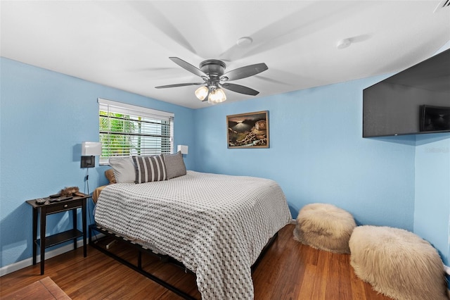 bedroom with ceiling fan and hardwood / wood-style floors