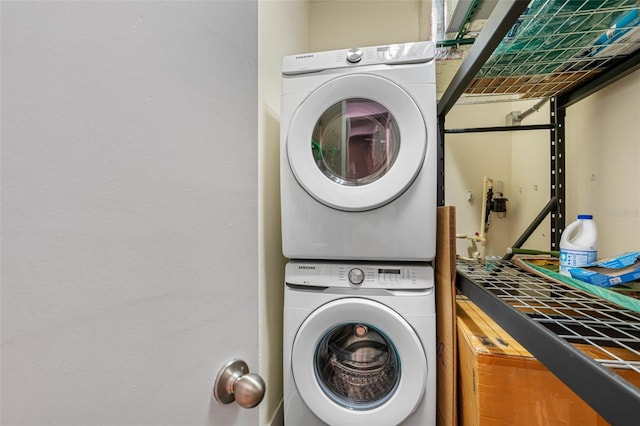 laundry area with stacked washing maching and dryer