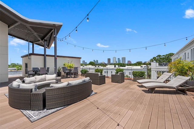 wooden terrace featuring an outdoor living space