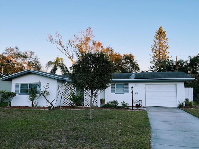 single story home with a front lawn and a garage