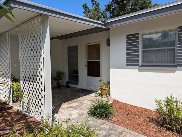 doorway to property with a patio area