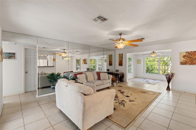 tiled living room with a textured ceiling