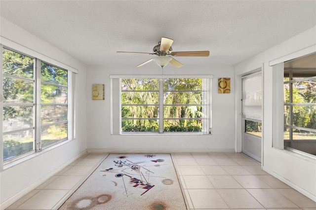 sunroom / solarium with ceiling fan