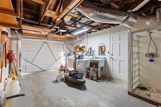 garage featuring a garage door opener and washer and clothes dryer