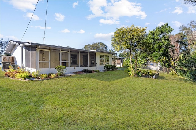 view of yard featuring a sunroom