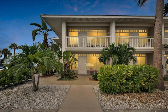 coastal inspired home featuring a balcony