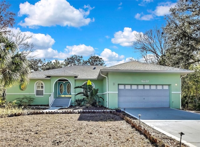 ranch-style home featuring a garage