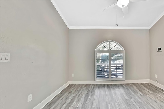 spare room featuring ceiling fan, light hardwood / wood-style floors, and crown molding