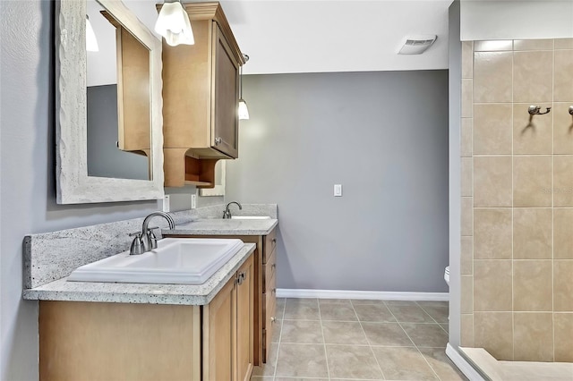 bathroom featuring tile patterned floors and vanity